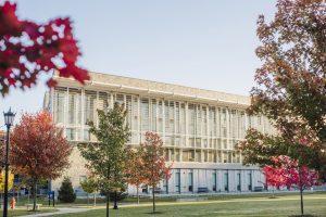 Front of RIC in fall, orange and red leaves on the trees